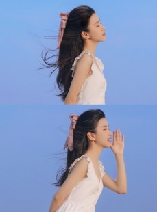 海边美女吊带白裙长发飘飘写真